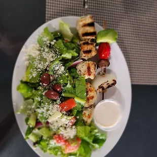 Single chicken shish kebab with free small veggie kabob and upgraded Greek salad with tahini sauce