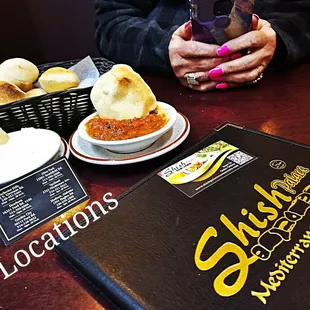 a person taking a picture of their food