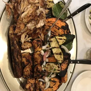 a plate of grilled meat and vegetables