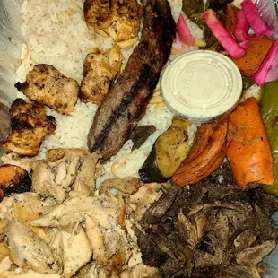 Part of the sampler for 2 - Chicken Shawarma, Lamb Shawarma, Shish Tawook and Shish Kafta with rice