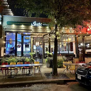 Store front with outdoor seating.