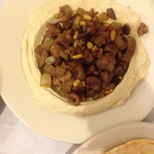 Hummus with beef. If you are not an onion fan don&apos;t order it. Yet the hummus is really good.