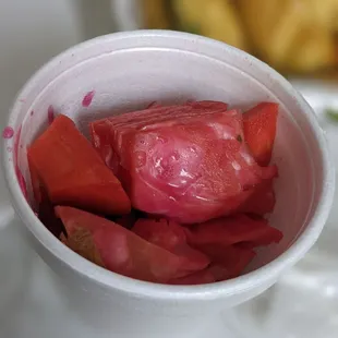 a bowl of sliced vegetables