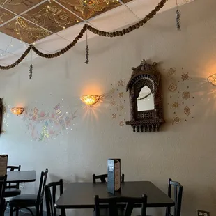 a dining area with tables and chairs