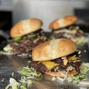 Incredible burgs. The authentic "Hella Jalapeño" burger seen on the left.