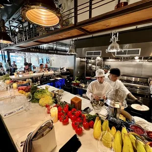 View of the kitchen from the bar seating