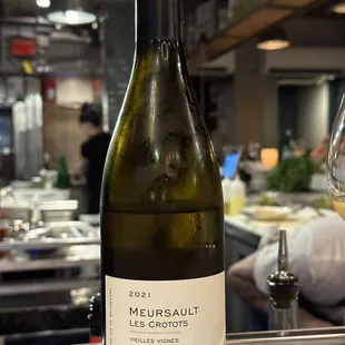 a bottle of wine and a glass of wine