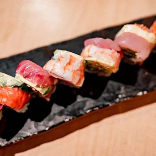 sushi on a black plate