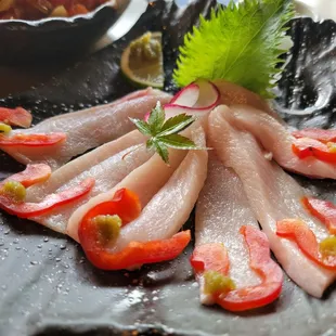 a plate of raw fish
