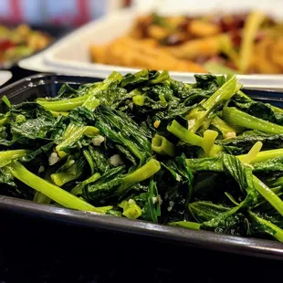 V12. Snow Pea Tips with Minced Garlic. $14.95. Takeout. Included a box of rice.