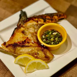 grilled fish with a side of salsa