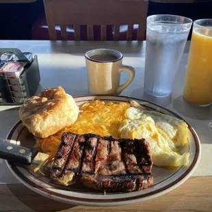 6oz ribeye and eggs medium rare. Biggest/freshest biscuit I've ever ate.