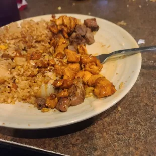 Yumyum sauce  with steak hibachi chicken. Eggs rice and vegetables with onion