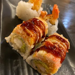 two pieces of sushi on a plate