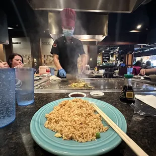 a plate of noodles and chopsticks