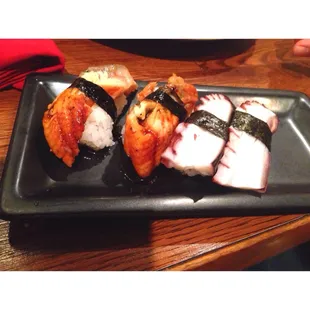 Eel sushi on the left and octopus sushi on the right. Both un-cooked