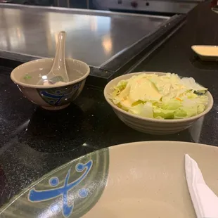 a bowl of salad and a bowl of salad
