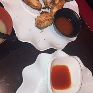 Complimentary fried veggie spring rolls, and the sake kama appetizer