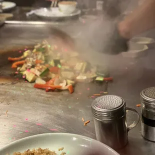 a plate of food being prepared
