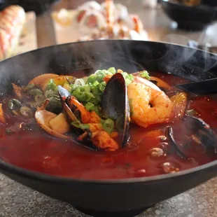Spicy ramen bowl coming in steaming and ready to devour.