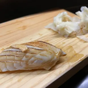 a piece of fish on a cutting board