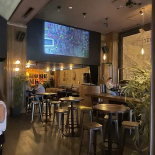 The view of the lounge area in the back of the bar with a DJ booth.