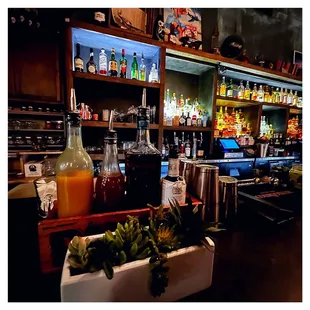 a bar filled with bottles of alcohol