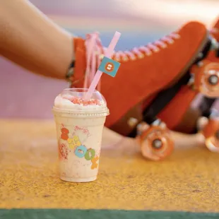 a person's legs with a skateboard in the background