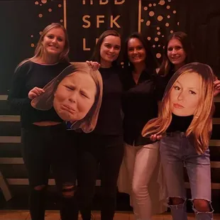 a group of women posing for a picture