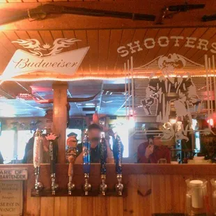 a bar with several beer taps