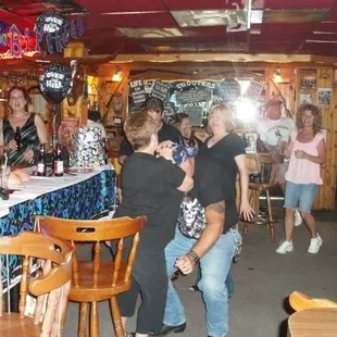 a group of people at a bar