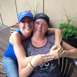 two women sitting on a bench