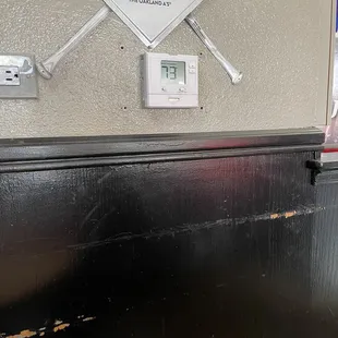a close up of a baseball bat on a wall