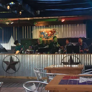 a group of people sitting at a bar