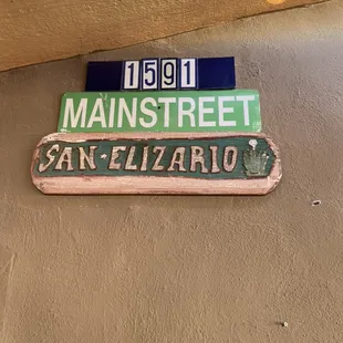 a street sign on a wall