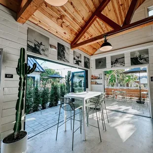 a patio with a table and chairs