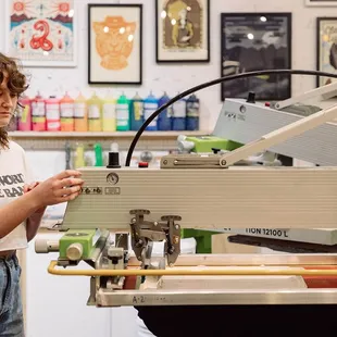 Our team of printers runs our printing presses on the daily, creating fresh prints of original designs.