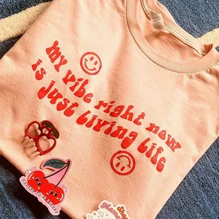 The cute stuff I scored! Shirt, cherry clip and sticker, and a free bee sticker from the owner! :)