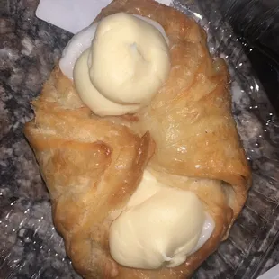 a pastry with cream on top