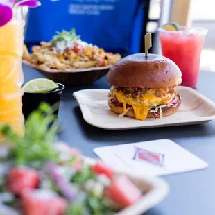 a table with plates of food and drinks