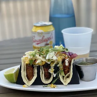 Blackened Wahoo Tacos  Wahoo Fish, avocado crema , mango and grilled corn slaw, salsa verde , lime