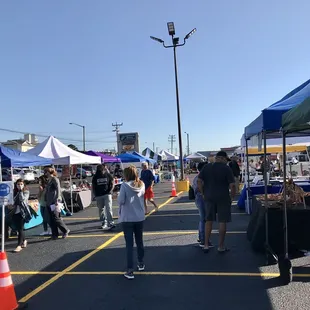 a crowd of people shopping