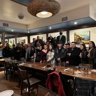 a large group of people posing for a picture