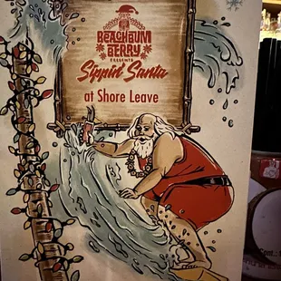 a man in a santa outfit on a surfboard