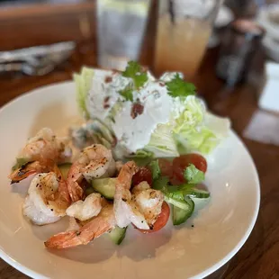Blue cheese wedge salad with grilled shrimp.