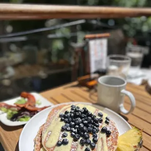 Buttermilk pancakes with blueberries &amp; cream looked pretty but pancakes were dry. The side of bacon was good.