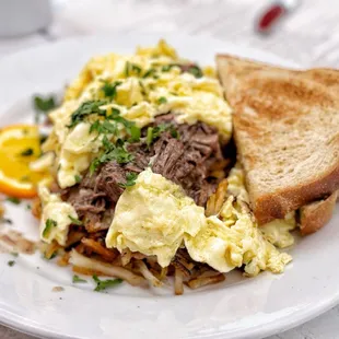 a plate of scrambled eggs and toast