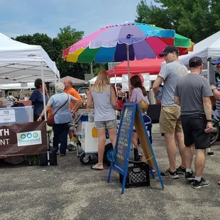 people standing under umbrellas