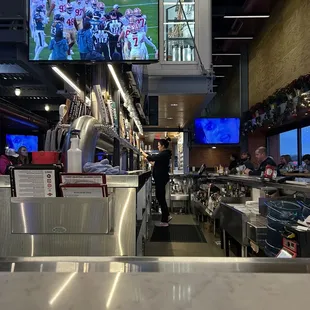 Bar area with lighted keg room above
