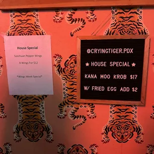 a sign on the wall of a restaurant